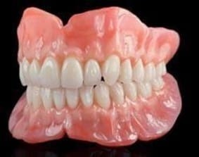 IMPLANTS VS DENTURES